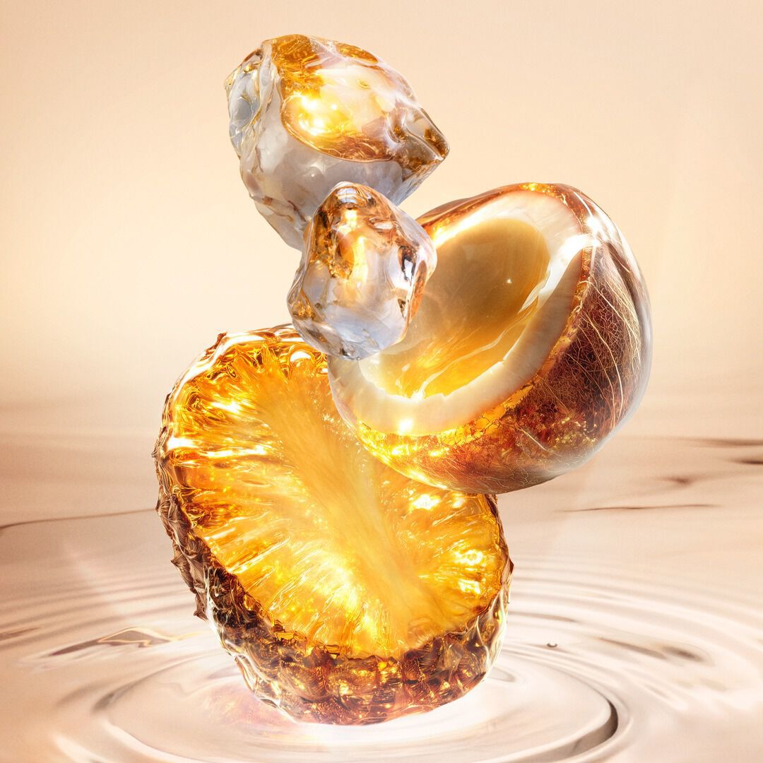 New Starlicious Pineapple Musk ingredient video showcasing its key ingredients: a glowing pineapple slice, a cracked coconut shell, and crystalline musk, all set against a warm, luminous rippling water background.