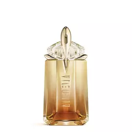 Mugler Alien Goddess Intense Eau de Parfum in golden amber talisman-shaped bottle with floral background