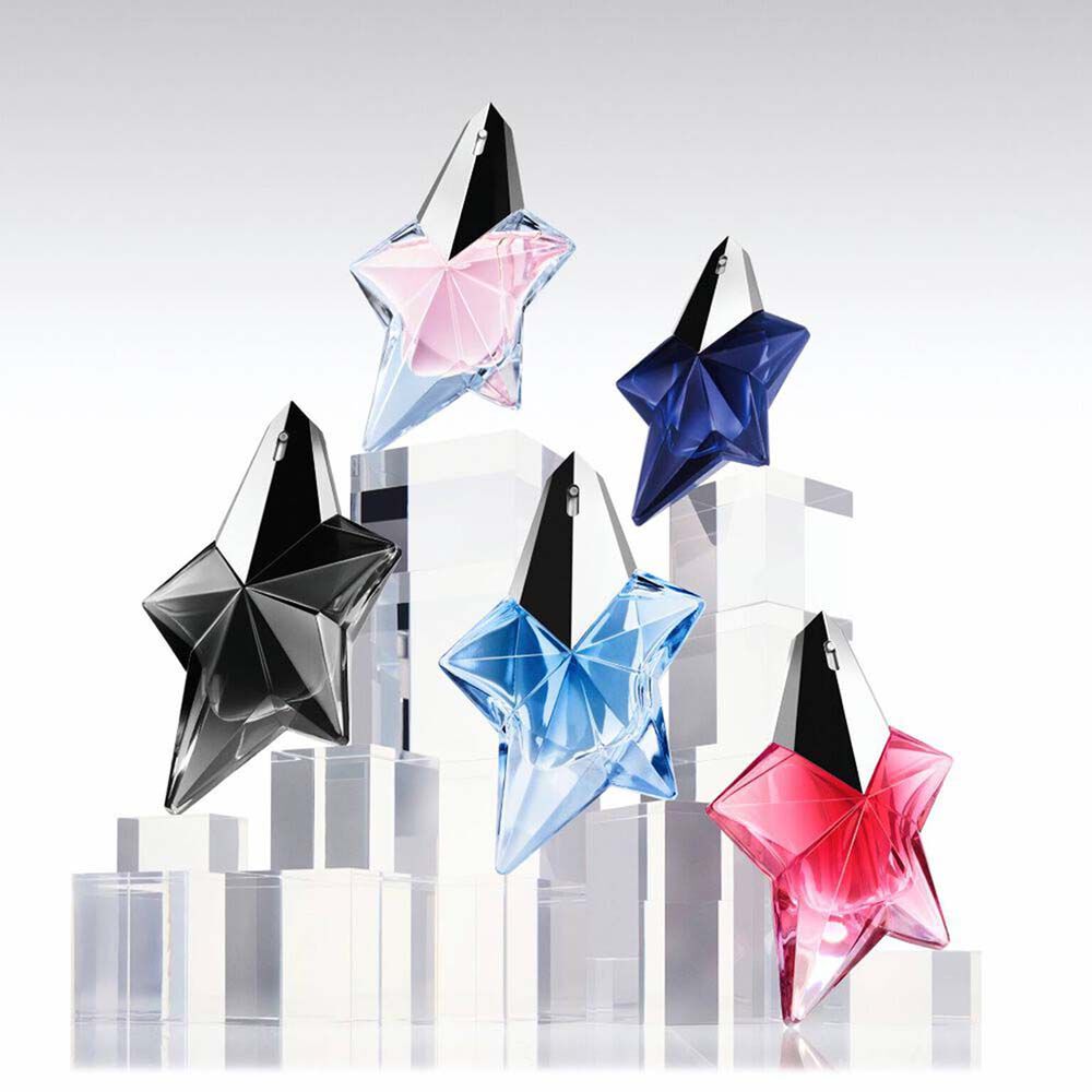 Five Mugler star perfume bottles in black, pink, blue, navy, and red on clear display blocks​