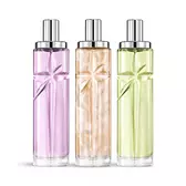 Starlicious the yummy swirl layering bundle packshot with Berry Licorice, Pineapple Musk, and Pistachio Praline, glass bottles with a carved shooting star, its facets shining bright beneath a sleek silver cap.