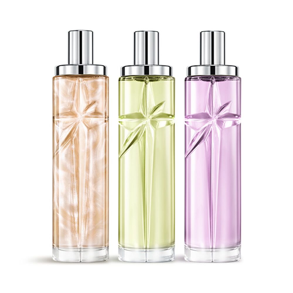 Starlicious the yummy swirl layering bundle packshot with Pineapple Musk, Pistachio Praline and Berry Licorice, glass bottles with a carved shooting star, its facets shining bright beneath a sleek silver cap.