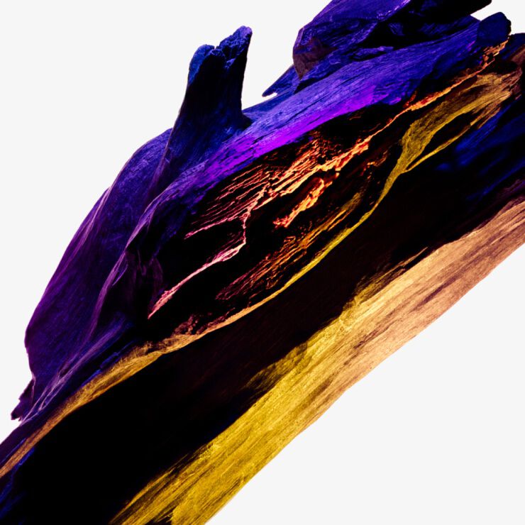 Alien by Mugler cashmeran wood texture in deep purple, black, and gold hues