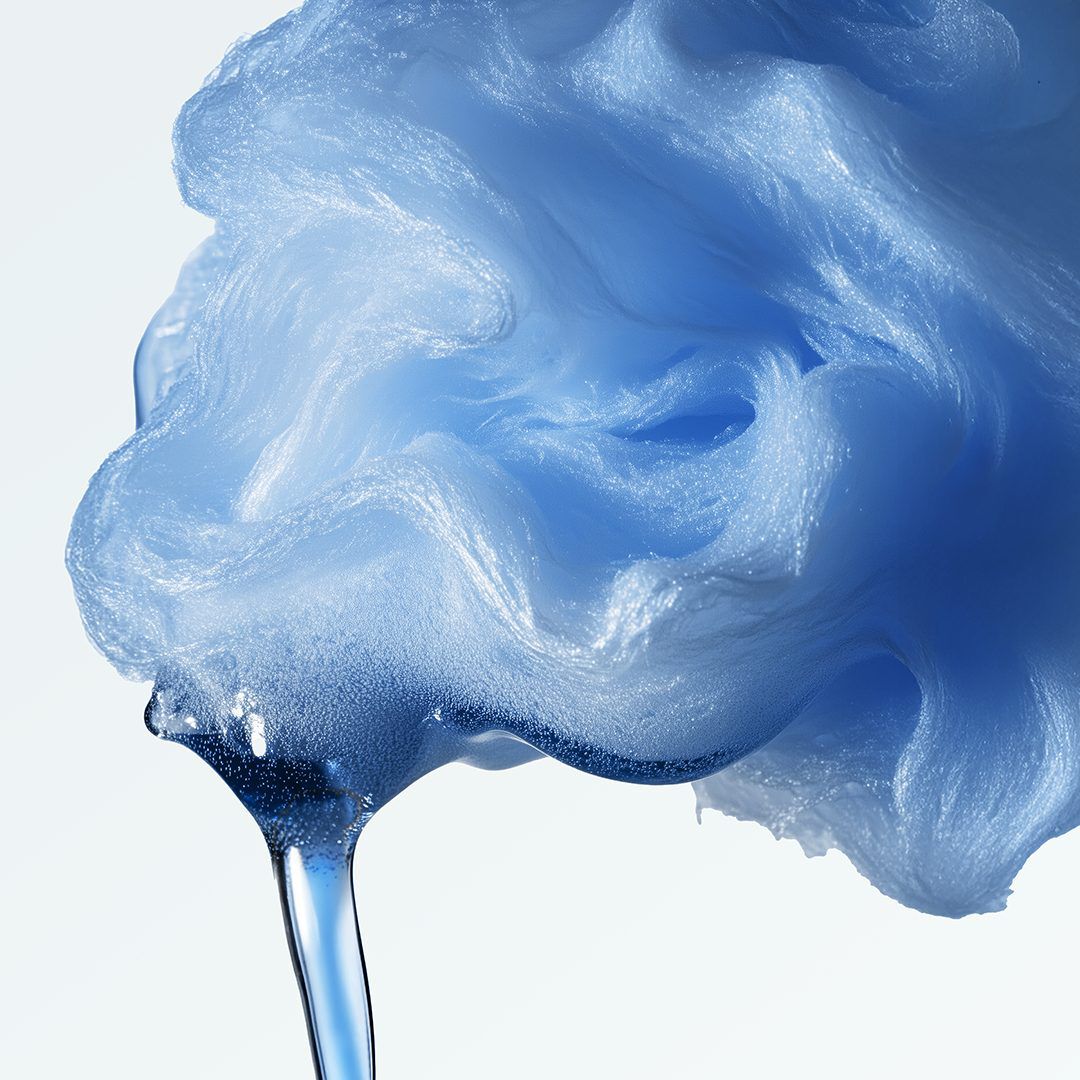 Swirling pale blue foam with glossy, melting texture on a light background