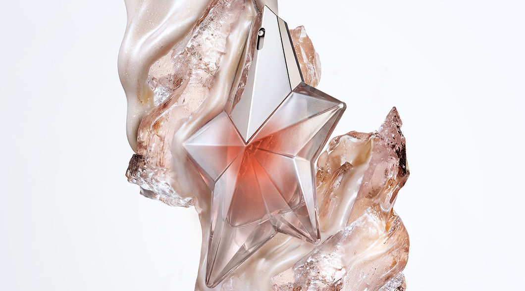 Mugler Angel Blush star perfume bottle with shimmering cream and translucent crystal textures.