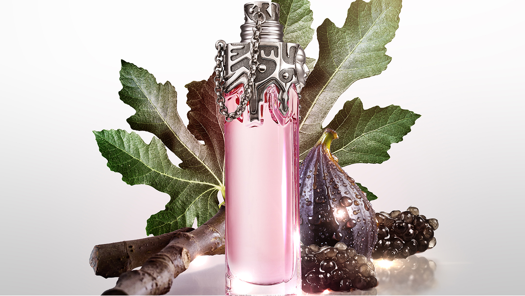Mugler Womanity pink perfume bottle with fig leaves, fig and caviar pearls