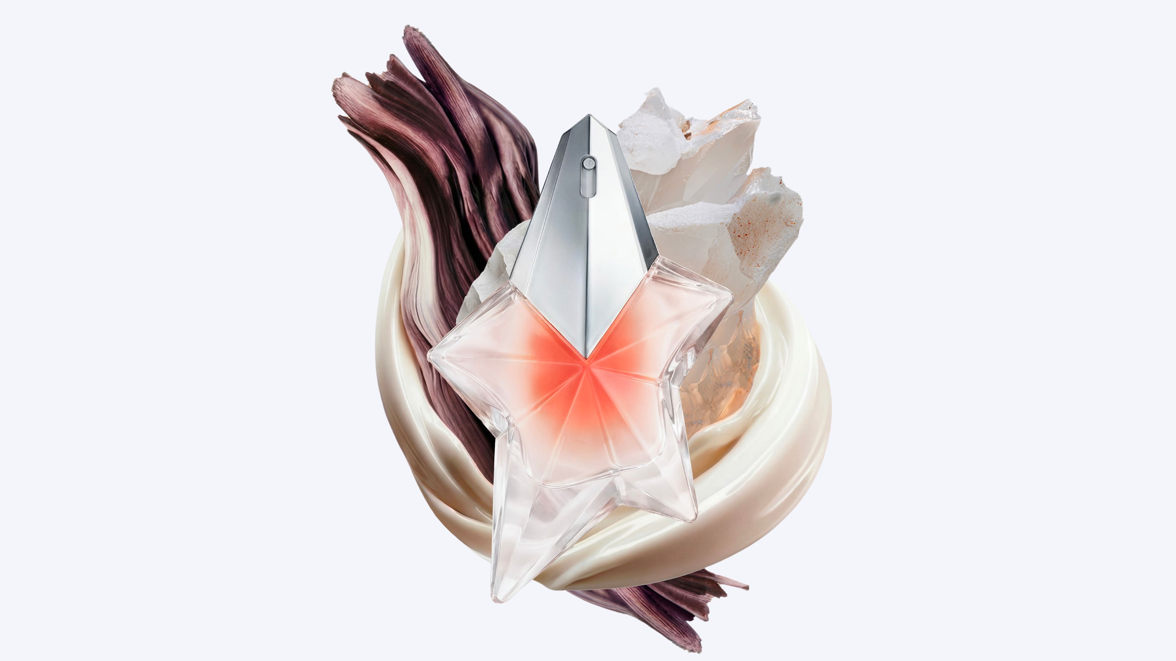 Mugler Angel Blush star perfume bottle with shimmering cream and translucent crystal textures.